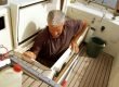 Man coming out of hatch on his boat