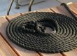 Boat line coiled up on deck next to boat
