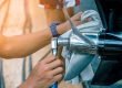 Person uses a socket wrench on a boat propeller.