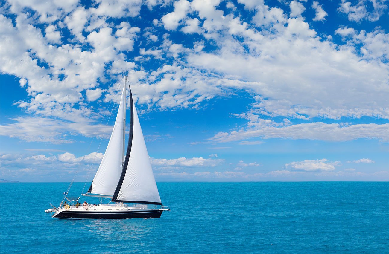 sail boat on the water from afar