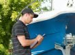 Man goes through a checklist while inspecting boat