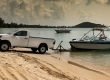 A truck releasing a boat into the water